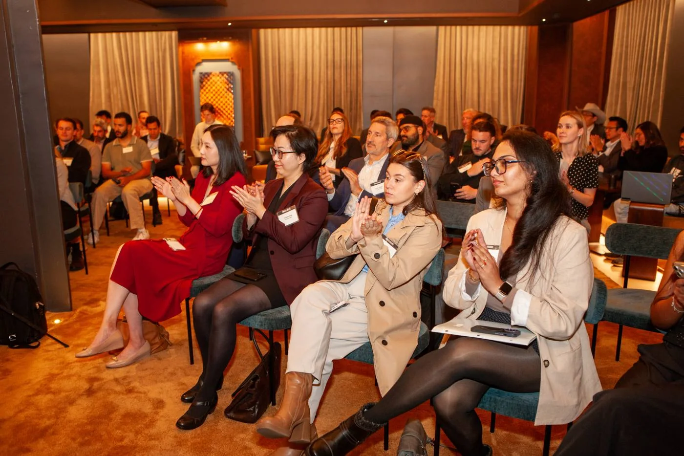 Guests applauding during the program